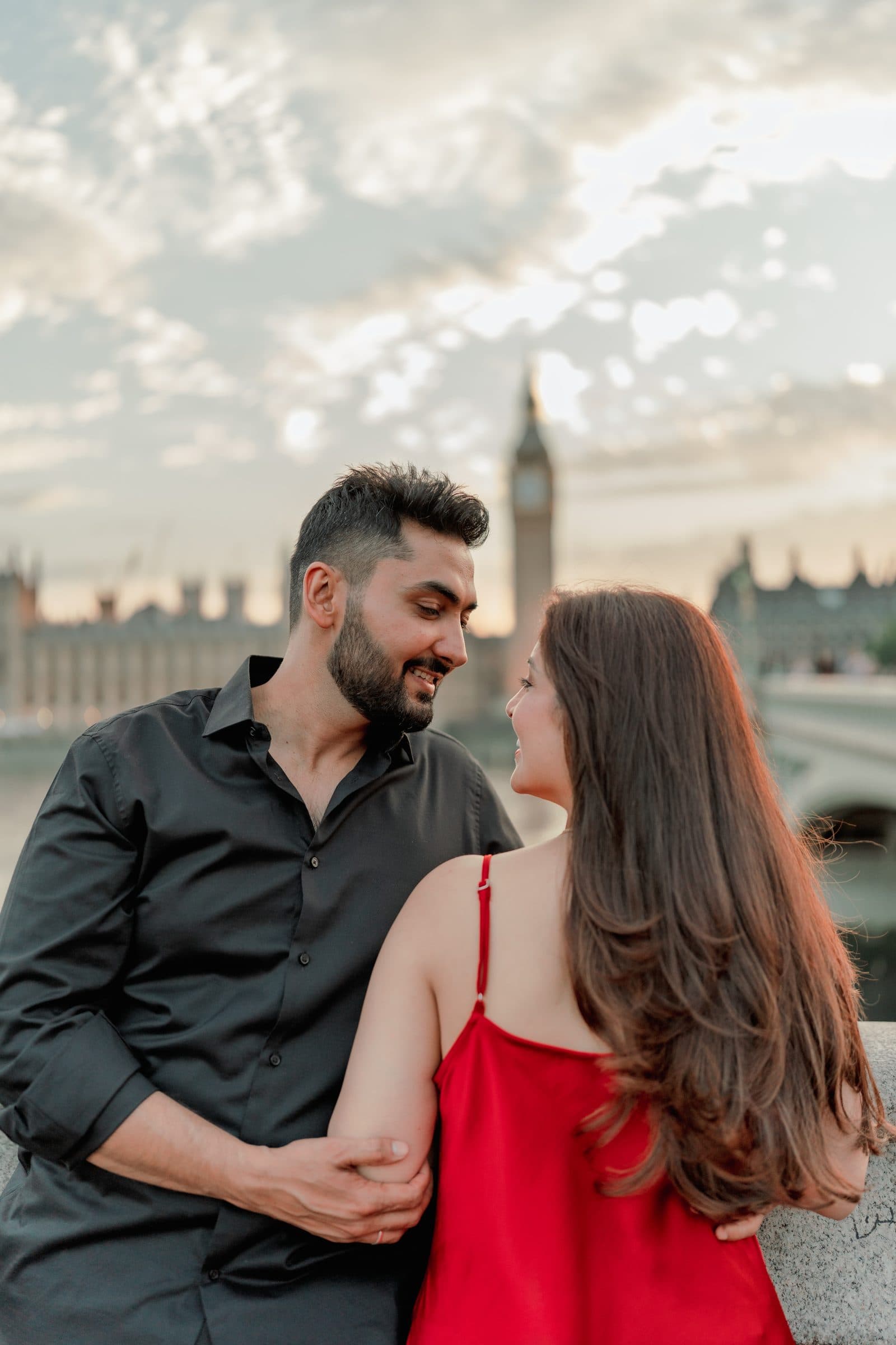 A close couple portrait at sunset by the Thames, Big Ben soft in the distance