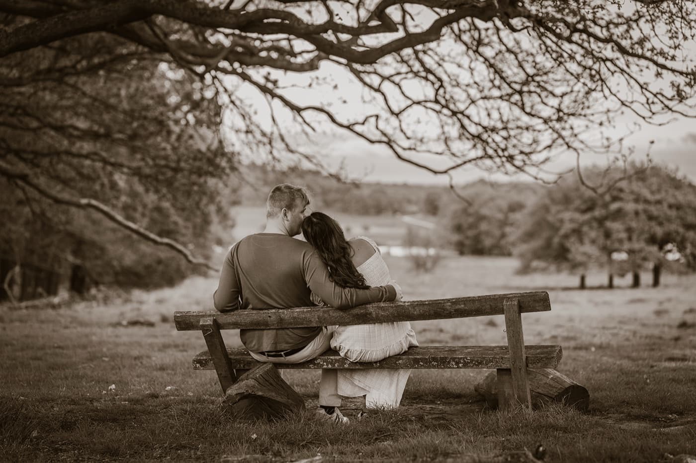 Couple sitting on a bench enjoying the view, portrait photography