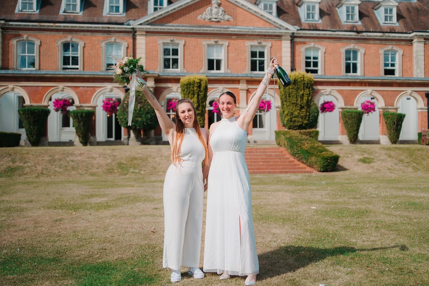 LGBT couple celebrating their marriage at a beautiful town hall in London